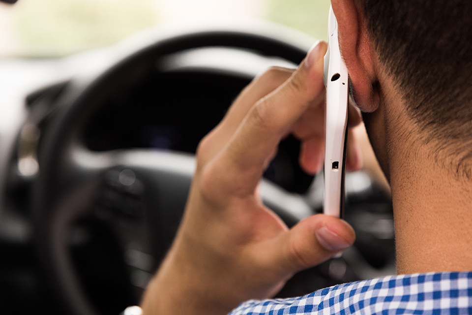 Mobile phone use while driving – Queensland charges and penalties